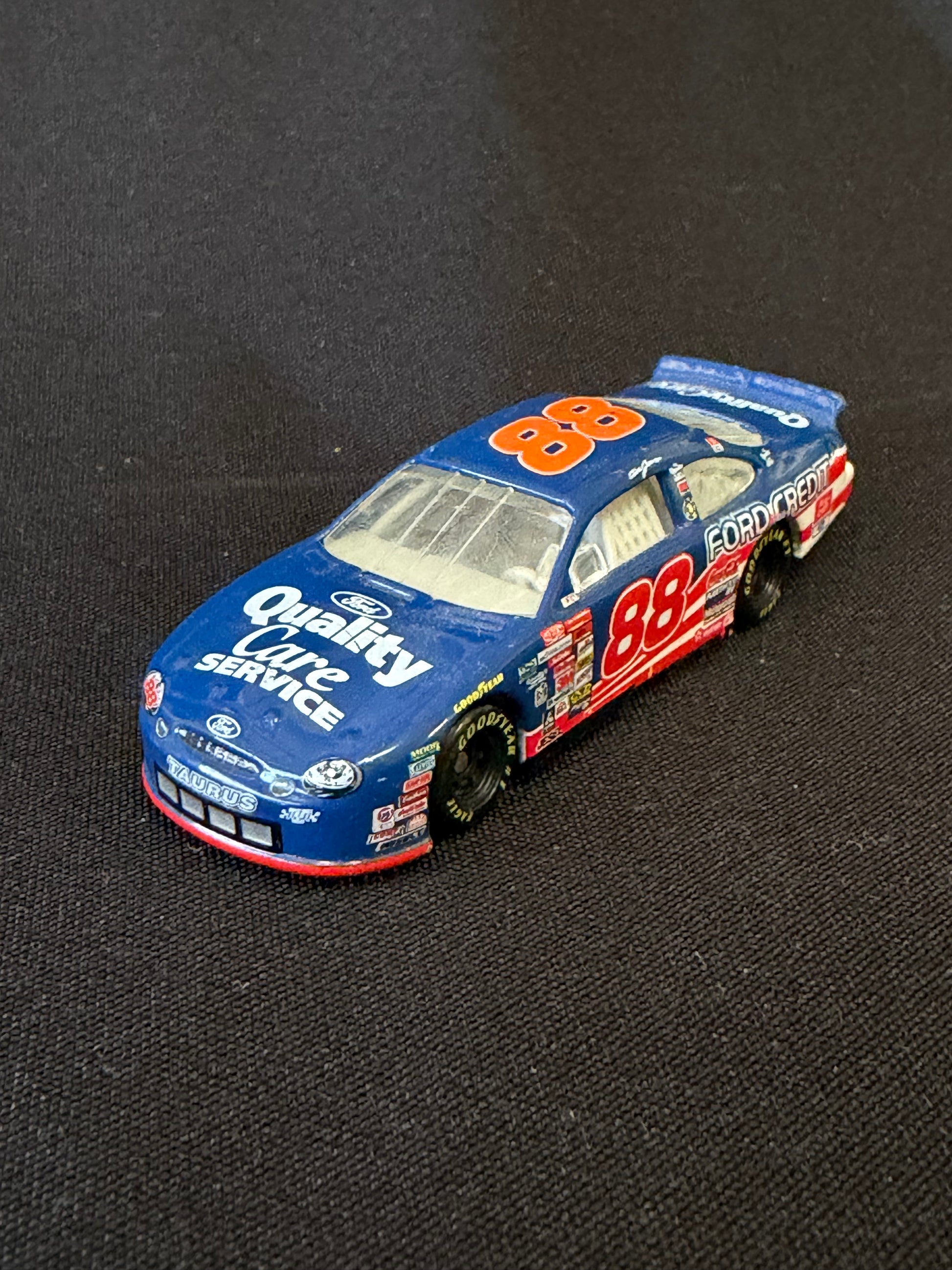 Model car with '88' and 'Quality Choice' branding on a black background